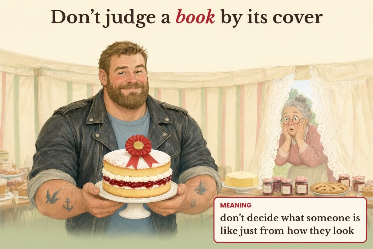 Storybook illustration of a burly tattooed biker in a leather jacket proudly holding a prize-winning Victoria sponge at a village show, while an old lady peeks through lace curtains in surprise. Text: Don't judge a book by its cover. Meaning: don't decide what someone is like just from how they look.