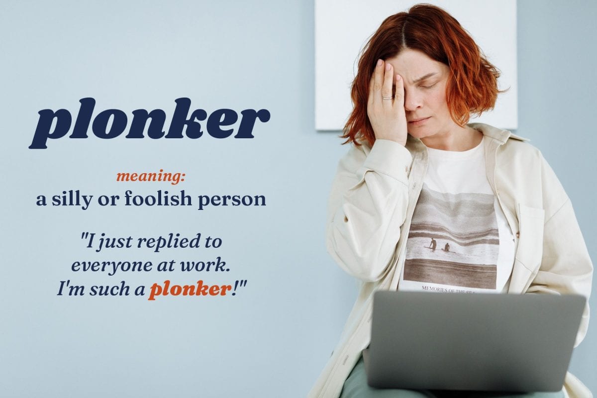 A woman sits with a laptop, hand on her forehead in embarrassment. Text: plonker, meaning a silly or foolish person. Example: I just replied to everyone at work. I'm such a plonker!