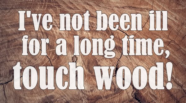 Illustrated quote about the British touch wood superstition